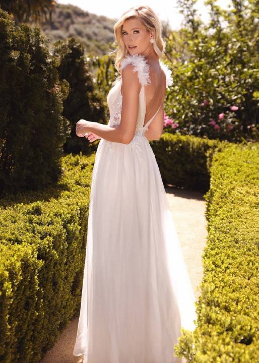 Model wearing a gown in a garden